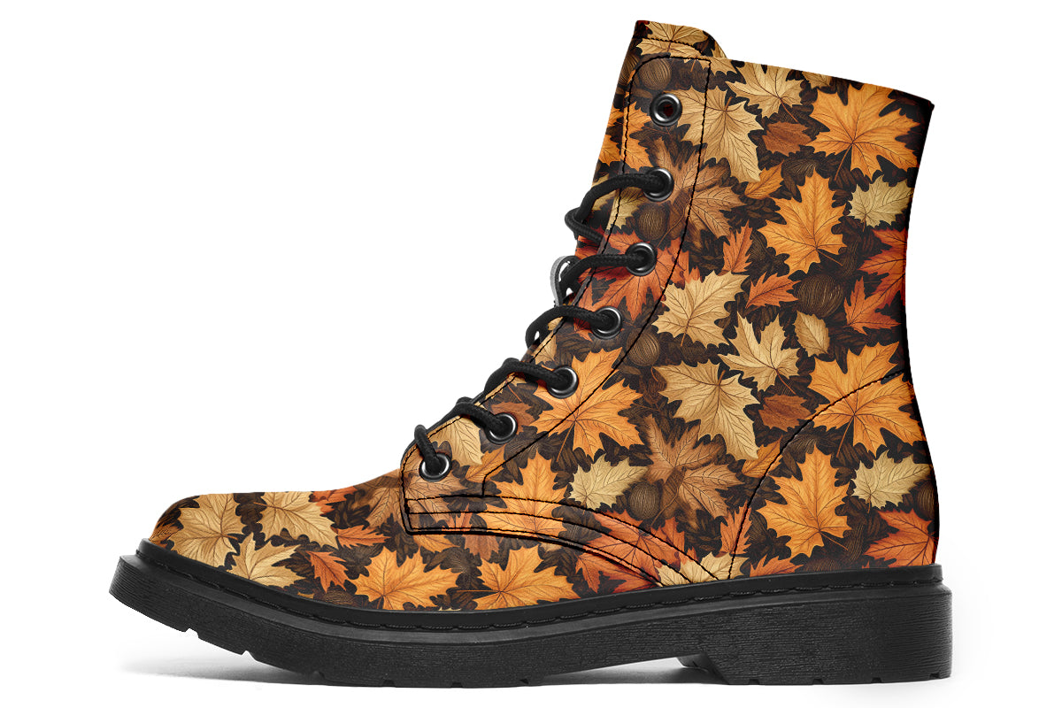 Dark brown boots featuring a pattern of autumn leaves in different shades of browns