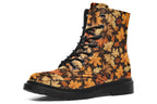 Dark brown boots featuring a pattern of autumn leaves in different shades of browns