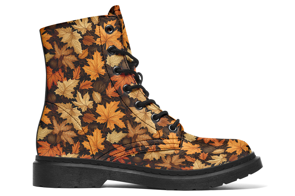 Dark brown boots featuring a pattern of autumn leaves in different shades of browns