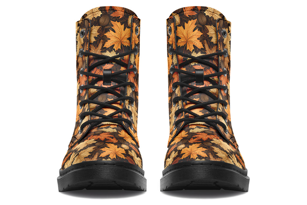 Dark brown boots featuring a pattern of autumn leaves in different shades of browns