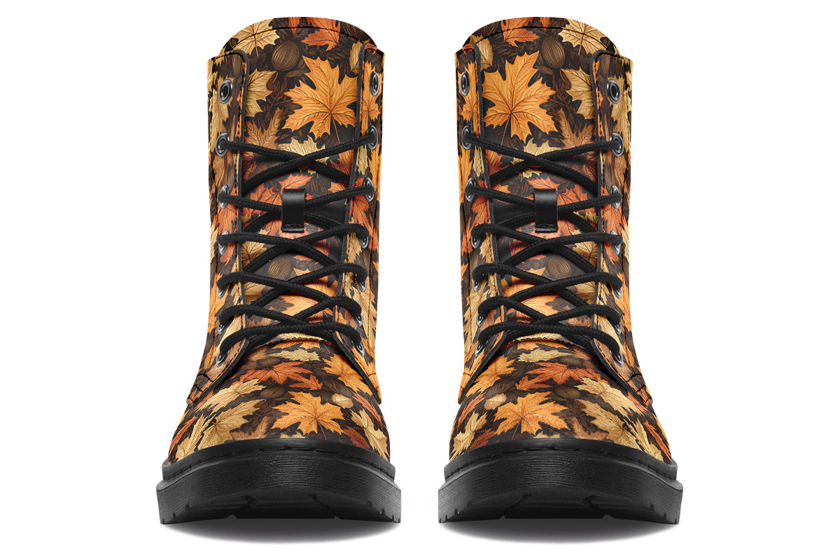 Dark brown boots featuring a pattern of autumn leaves in different shades of browns