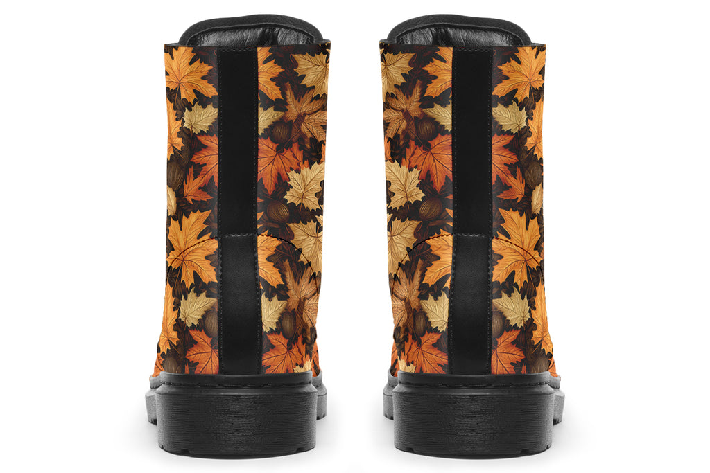 Dark brown boots featuring a pattern of autumn leaves in different shades of browns