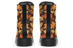 Dark brown boots featuring a pattern of autumn leaves in different shades of browns