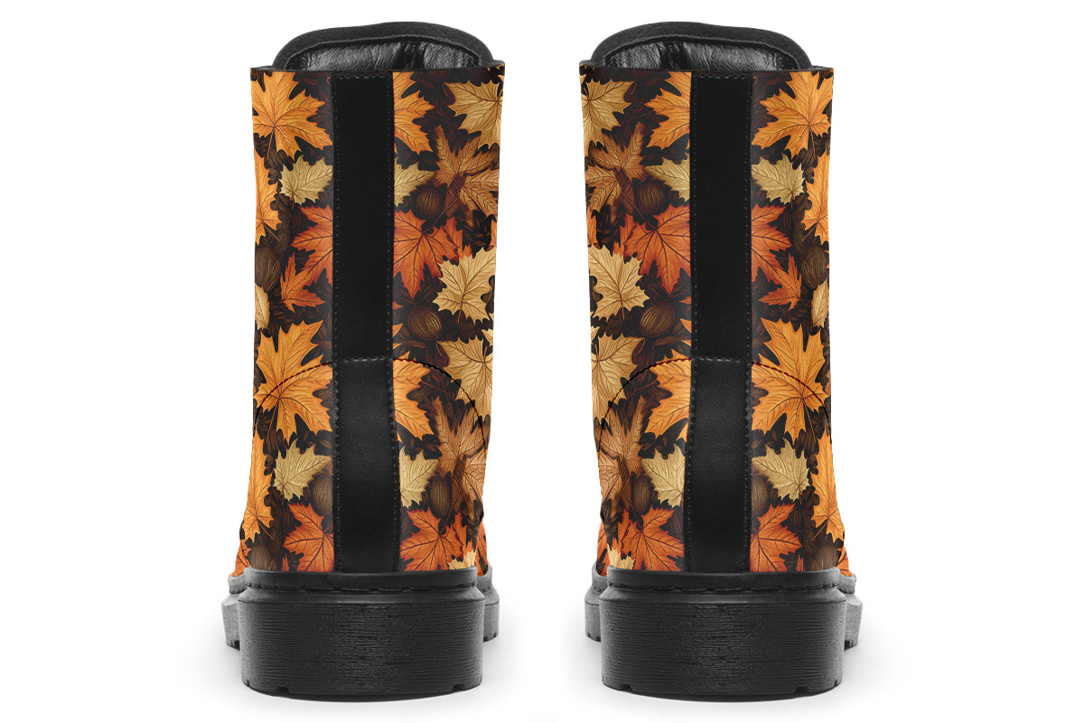 Dark brown boots featuring a pattern of autumn leaves in different shades of browns