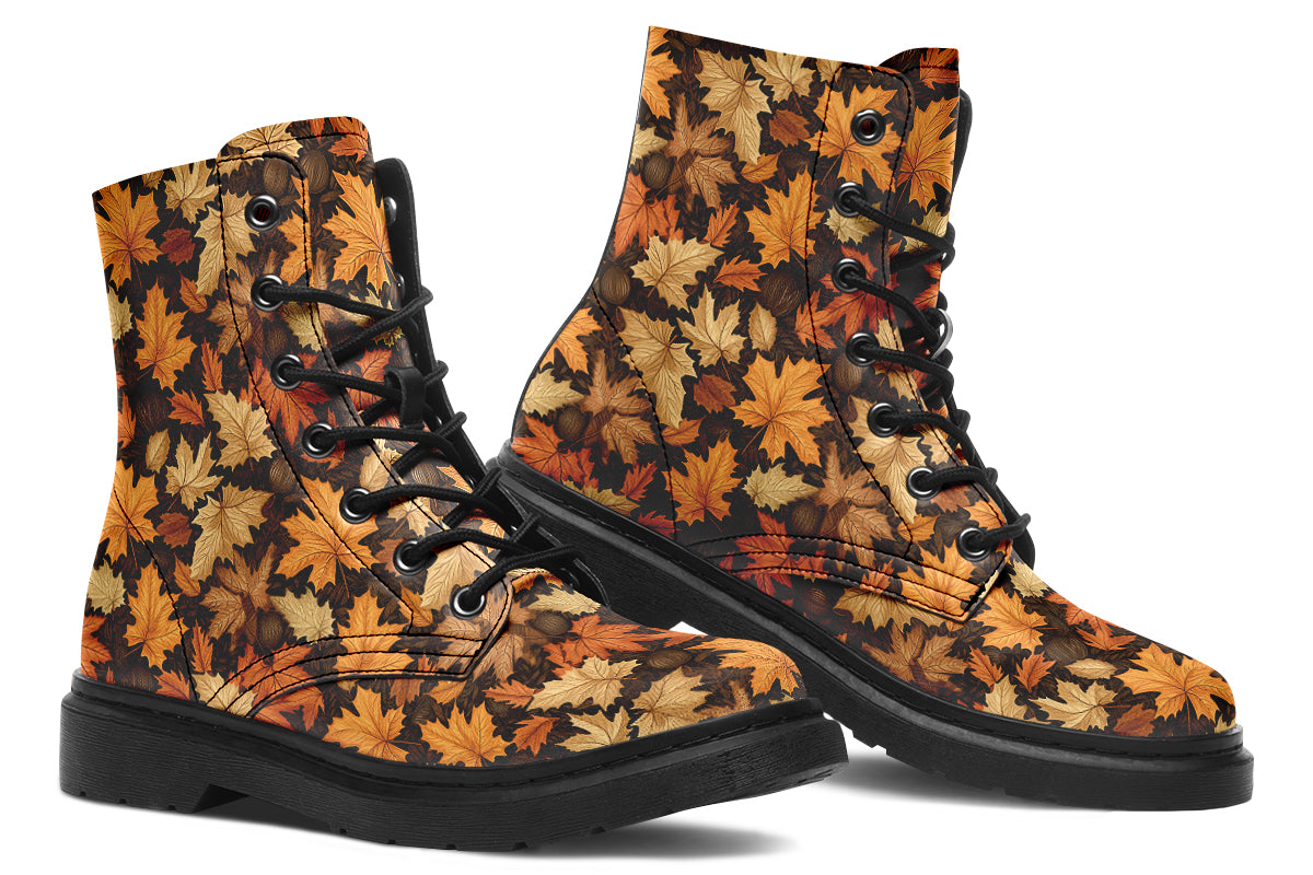 Dark brown boots featuring a pattern of autumn leaves in different shades of browns