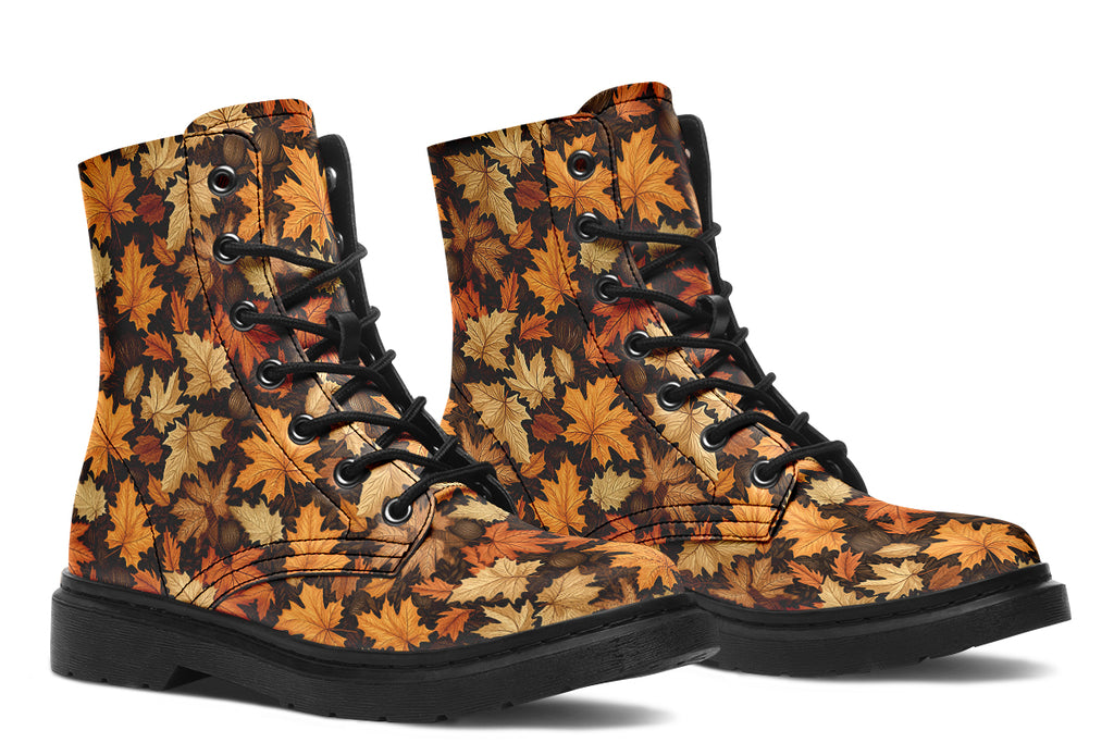 Dark brown boots featuring a pattern of autumn leaves in different shades of browns