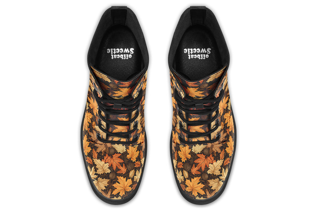 Dark brown boots featuring a pattern of autumn leaves in different shades of browns