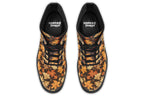 Dark brown boots featuring a pattern of autumn leaves in different shades of browns