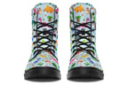 Light blue boots with a pattern of different coloured cute baby dinosaurs, prehistoric-looking trees and dinosaur eggs