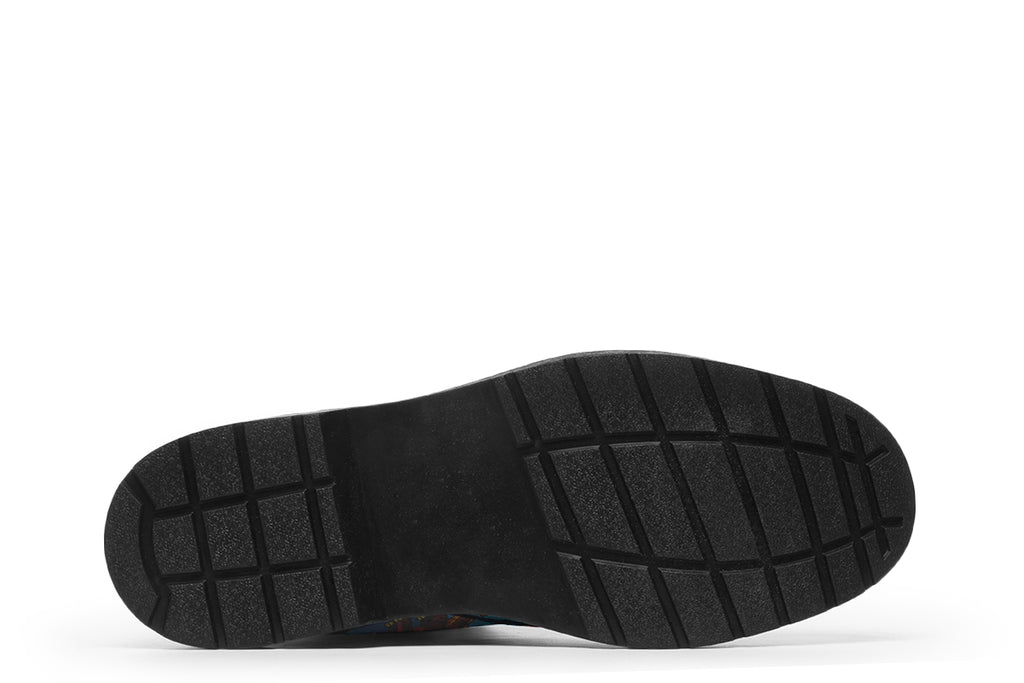 Light blue boots with a pattern of different coloured cute baby dinosaurs, prehistoric-looking trees and dinosaur eggs