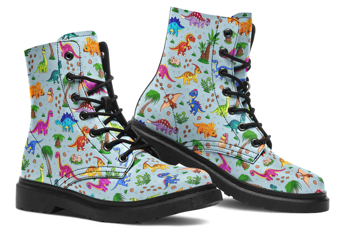 Light blue boots with a pattern of different coloured cute baby dinosaurs, prehistoric-looking trees and dinosaur eggs
