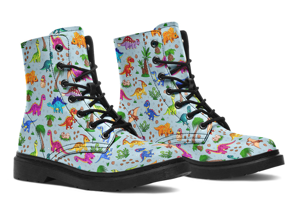 Light blue boots with a pattern of different coloured cute baby dinosaurs, prehistoric-looking trees and dinosaur eggs