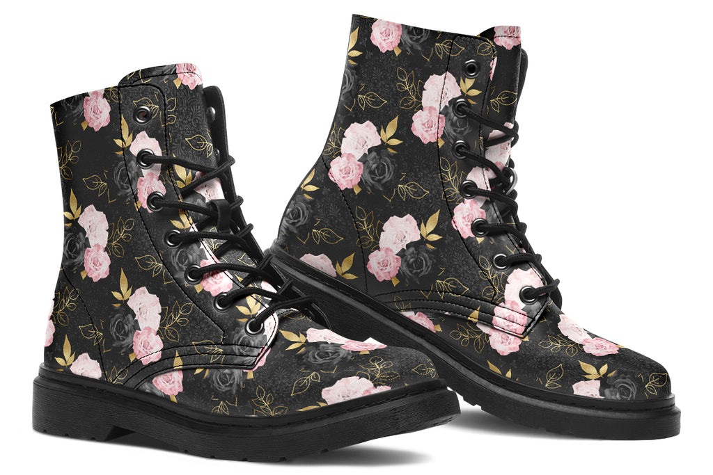 Black boots with a repetitive patterns of blush pink and black roses with gold leaves