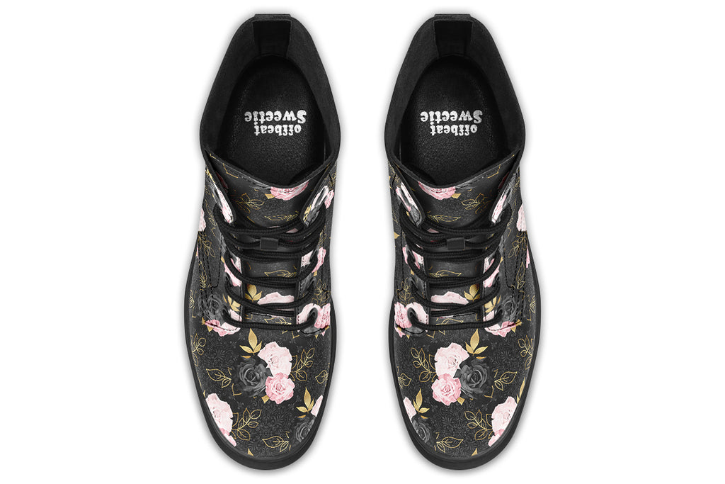 Black boots with a repetitive patterns of blush pink and black roses with gold leaves