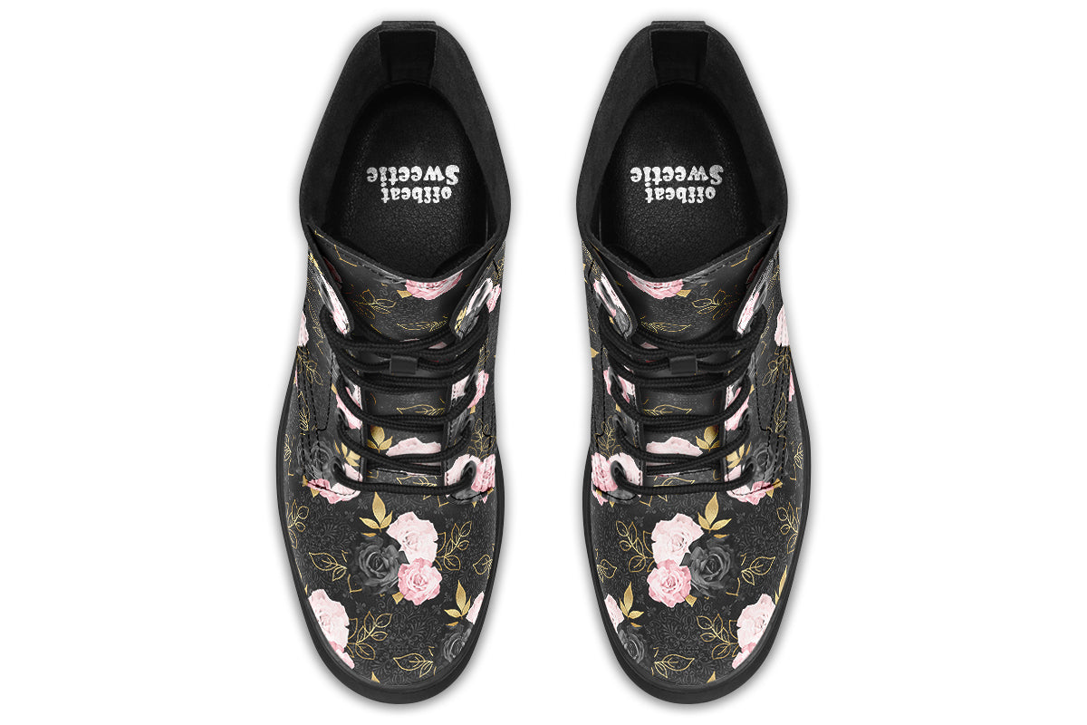 Black boots with a repetitive patterns of blush pink and black roses with gold leaves
