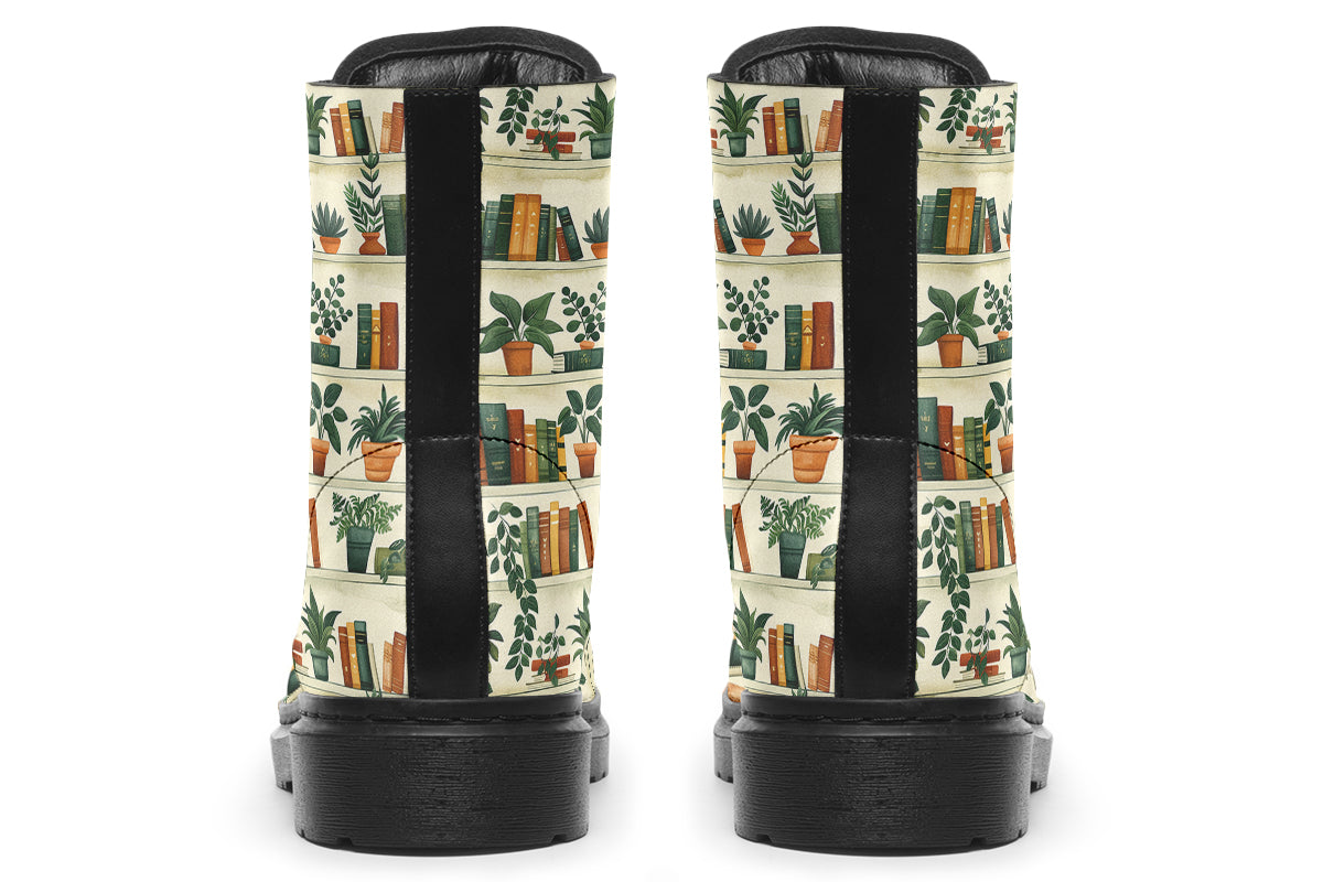 Cream coloured boots featuring a pattern of bookshelves with books and potted plants on them