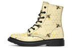 Light yellowish/cream boots with a pattern of faded gold honeycomb and sporadic bees