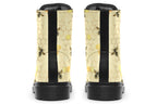 Light yellowish/cream boots with a pattern of faded gold honeycomb and sporadic bees