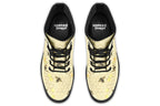 Light yellowish/cream boots with a pattern of faded gold honeycomb and sporadic bees