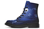 Deep blue boots with an image of white butterflies flying at night around stars and the moon