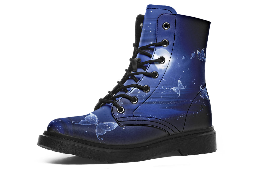 Deep blue boots with an image of white butterflies flying at night around stars and the moon