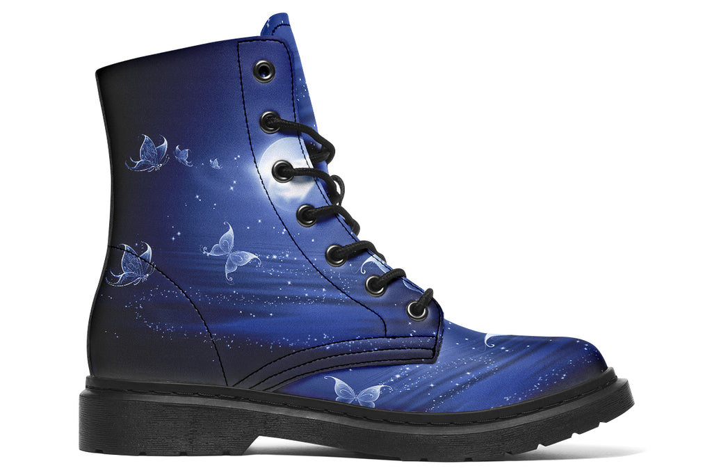 Deep blue boots with an image of white butterflies flying at night around stars and the moon