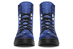 Deep blue boots with an image of white butterflies flying at night around stars and the moon