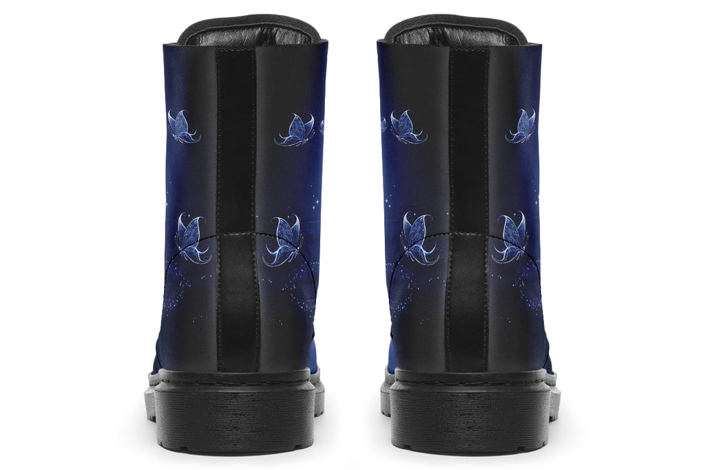 Deep blue boots with an image of white butterflies flying at night around stars and the moon