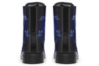 Deep blue boots with an image of white butterflies flying at night around stars and the moon