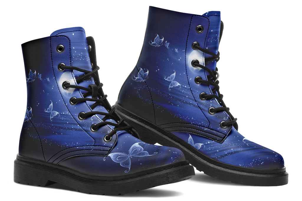 Deep blue boots with an image of white butterflies flying at night around stars and the moon