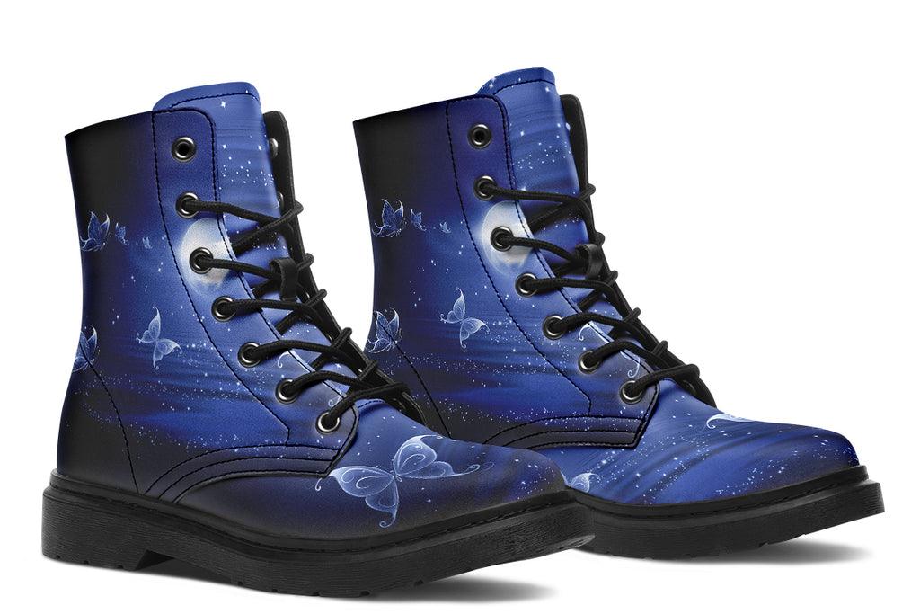 Deep blue boots with an image of white butterflies flying at night around stars and the moon