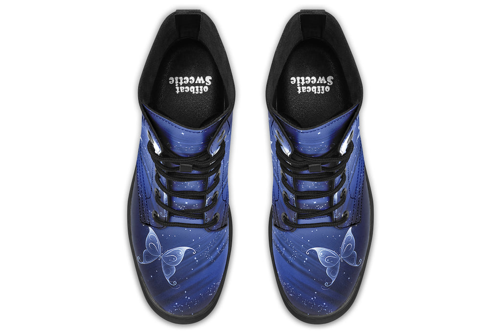 Deep blue boots with an image of white butterflies flying at night around stars and the moon
