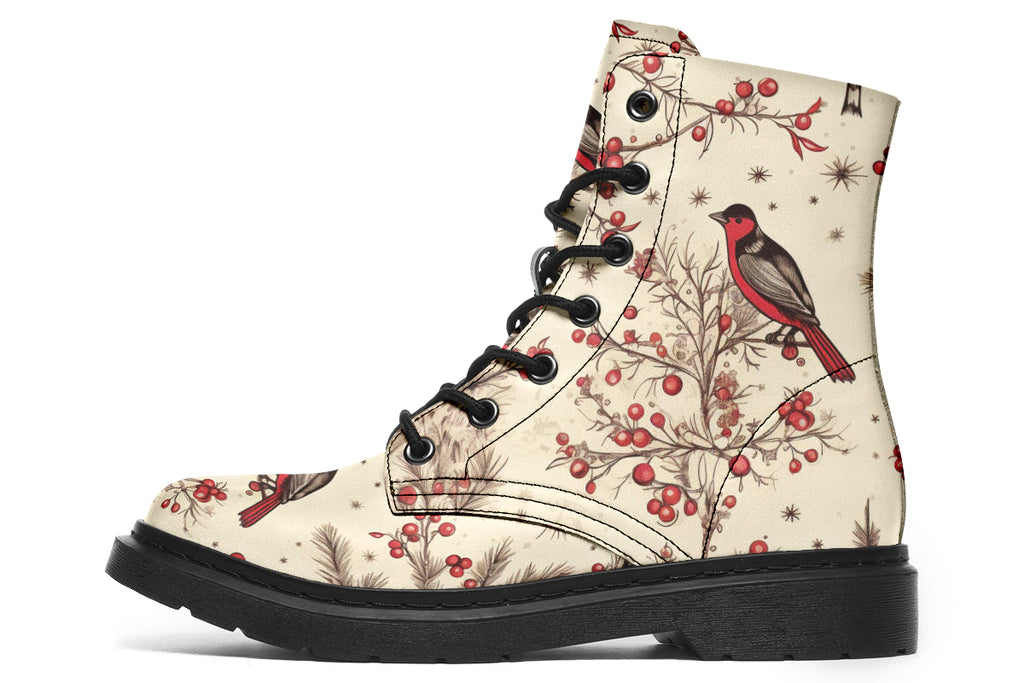 Cream coloured boots featuring images of brown tree branches with red berries, and red and black birds sitting on the branches.