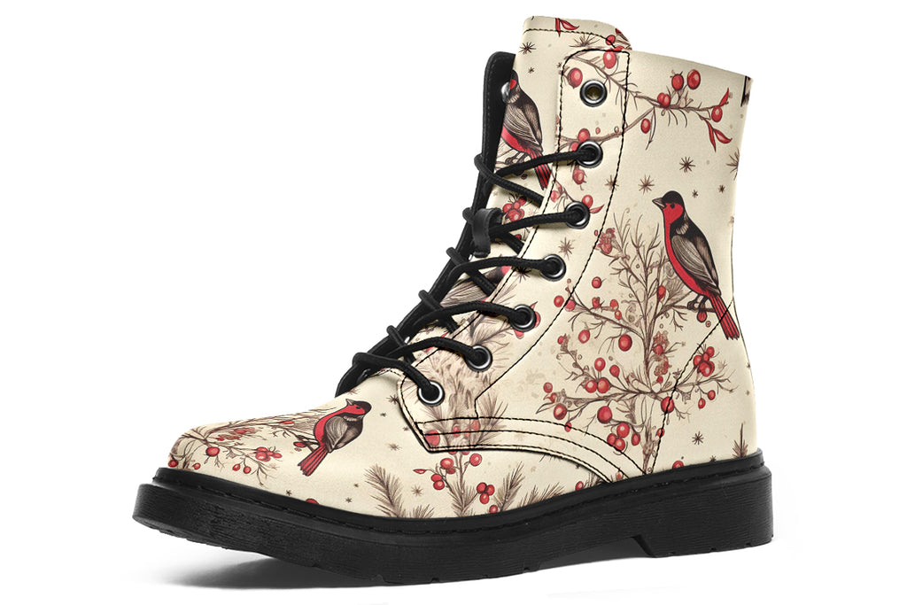Cream coloured boots featuring images of brown tree branches with red berries, and red and black birds sitting on the branches.