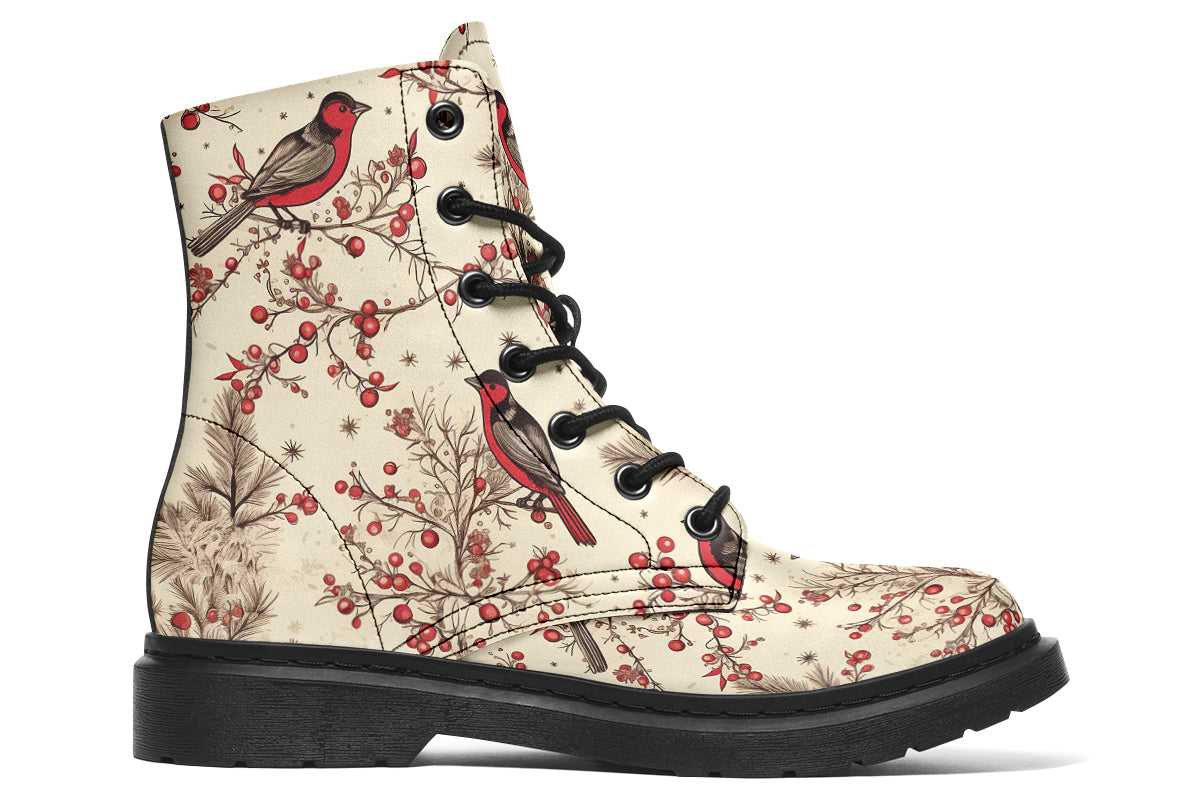 Cream coloured boots featuring images of brown tree branches with red berries, and red and black birds sitting on the branches.