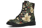 Boots featuring a design with deep green leaves, white flowers and red berries.