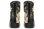 Boots featuring a design with deep green leaves, white flowers and red berries.