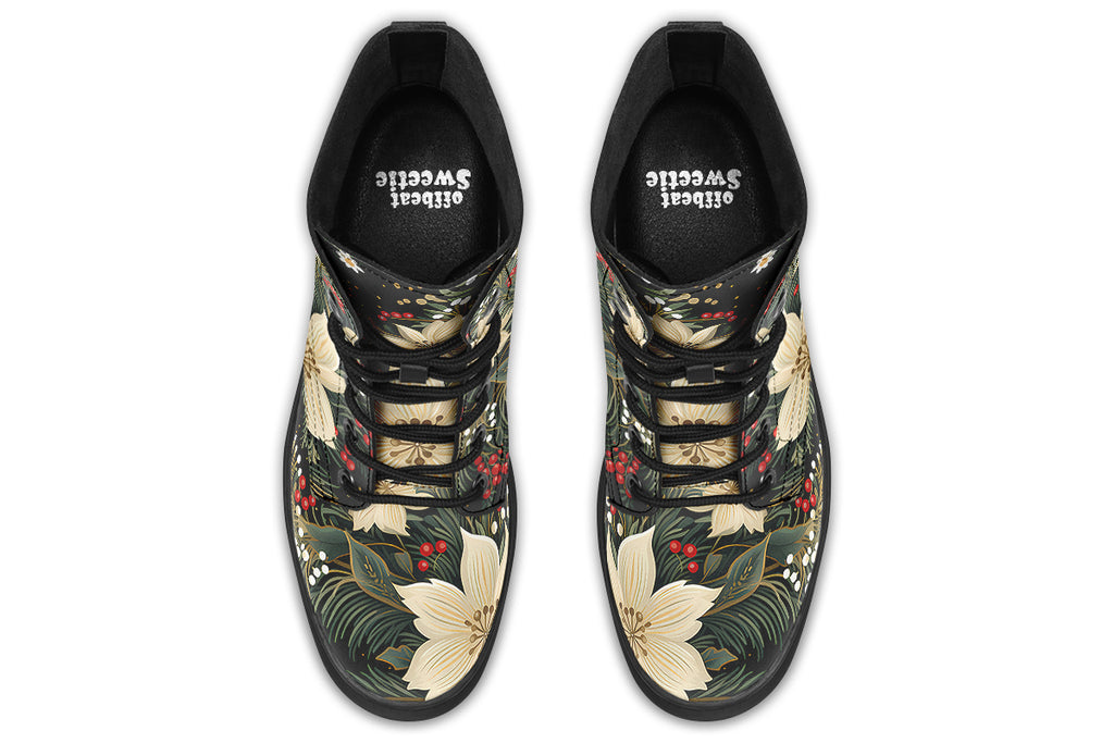 Boots featuring a design with deep green leaves, white flowers and red berries.