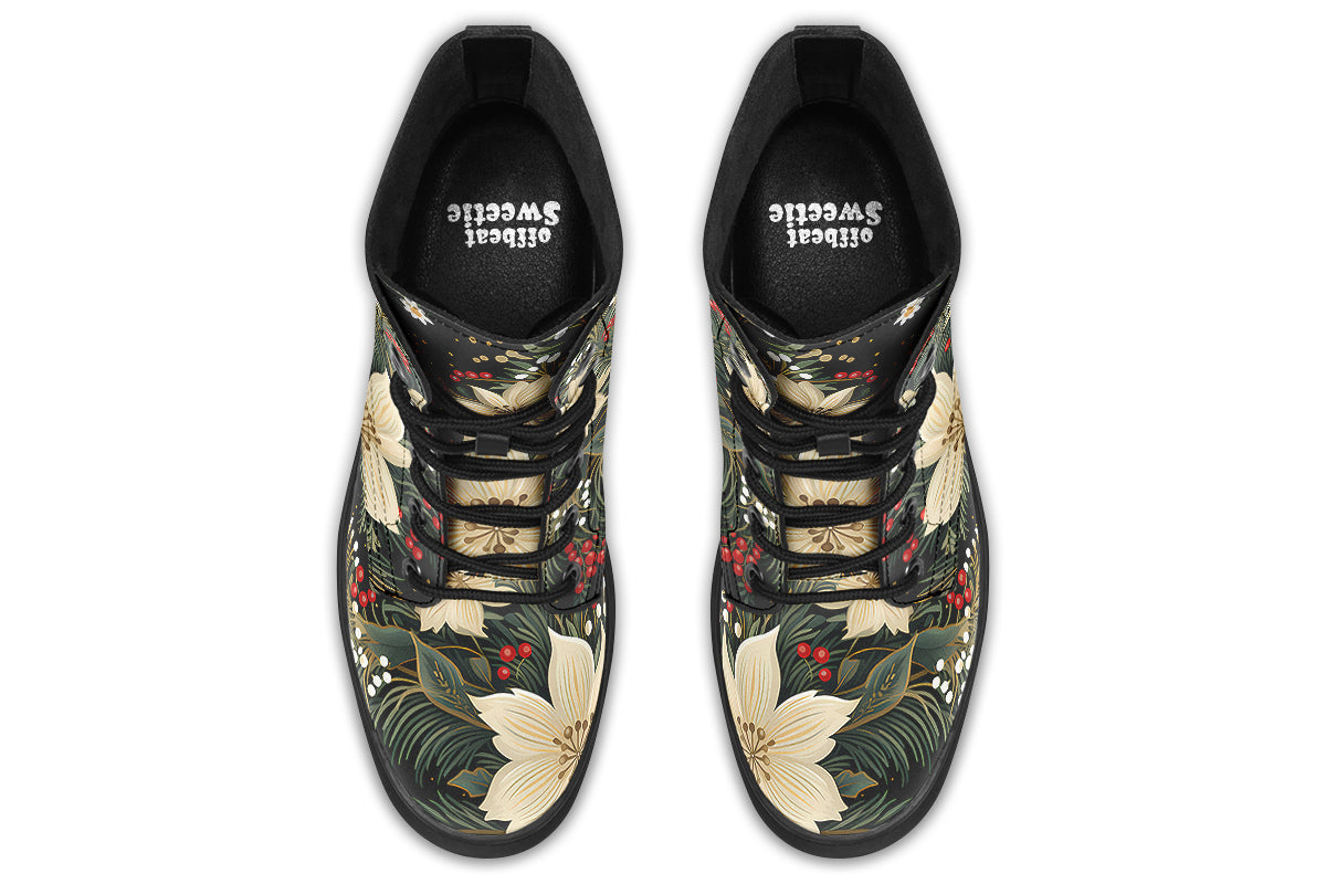 Boots featuring a design with deep green leaves, white flowers and red berries.