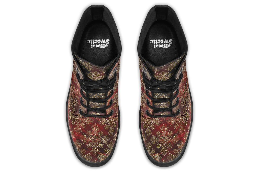 Boots in a deep red and gold textured pattern, like one might find on Christmas wrapping paper