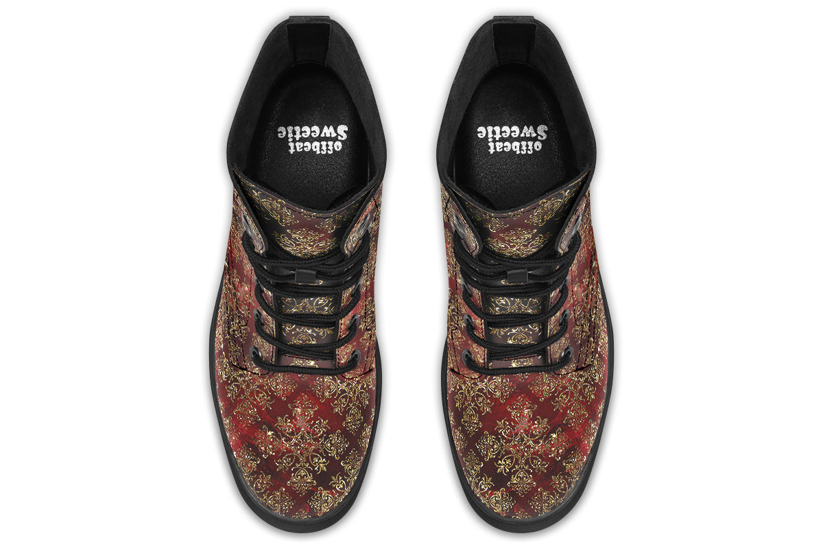 Boots in a deep red and gold textured pattern, like one might find on Christmas wrapping paper