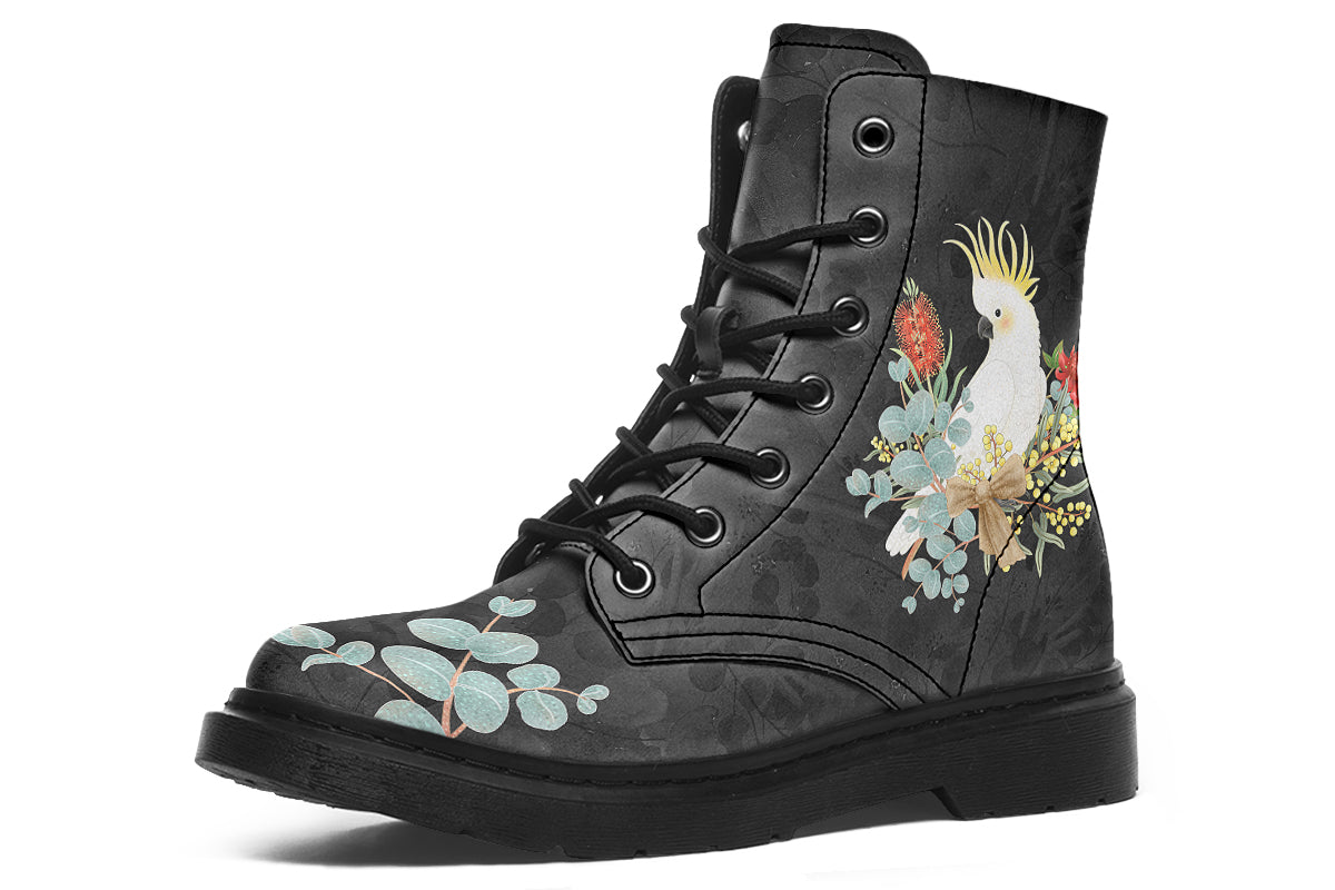Boots with a subtle black leaves background, with an image of a cockatoo and Australian flora