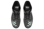 Boots with a subtle black leaves background, with an image of a cockatoo and Australian flora