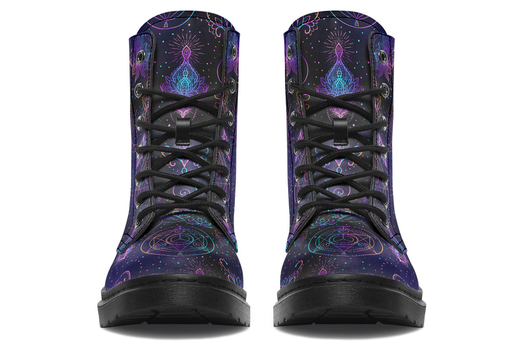 Boots featuring a dark violet, almost black background with a rainbow gradient pattern of different symbols such as a lotus flower, moon, star, decorative dots and swirls and a blue eye surrounded by a circle and line patterns.