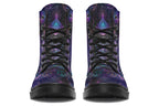 Boots featuring a dark violet, almost black background with a rainbow gradient pattern of different symbols such as a lotus flower, moon, star, decorative dots and swirls and a blue eye surrounded by a circle and line patterns.