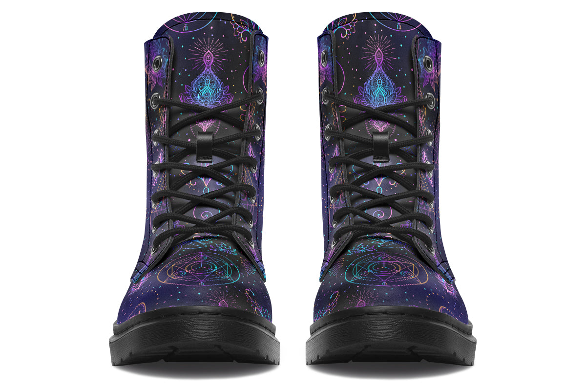 Boots featuring a dark violet, almost black background with a rainbow gradient pattern of different symbols such as a lotus flower, moon, star, decorative dots and swirls and a blue eye surrounded by a circle and line patterns.