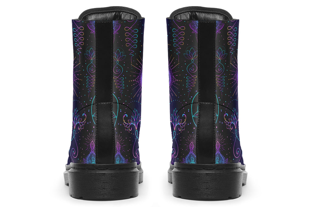 Boots featuring a dark violet, almost black background with a rainbow gradient pattern of different symbols such as a lotus flower, moon, star, decorative dots and swirls and a blue eye surrounded by a circle and line patterns.