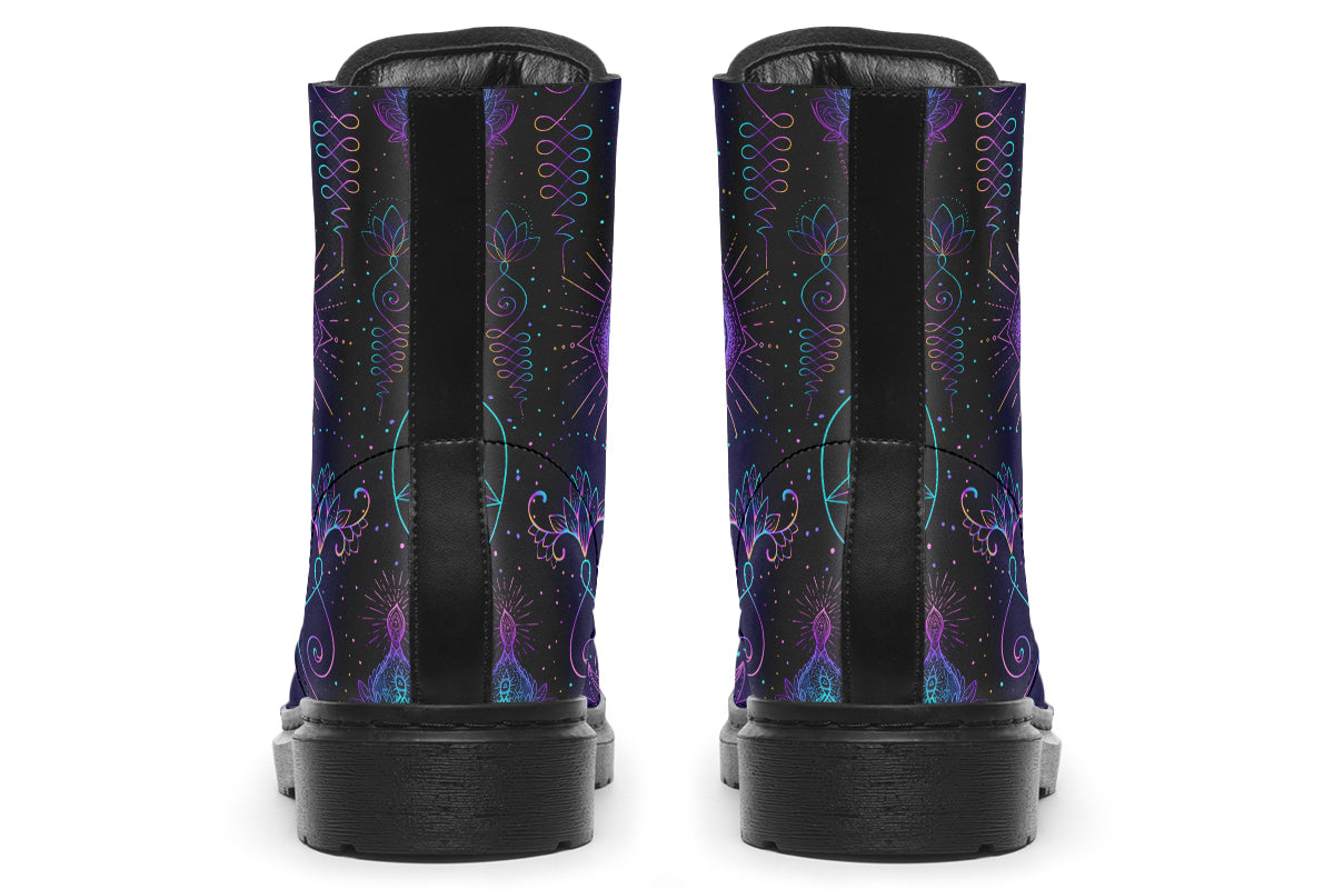 Boots featuring a dark violet, almost black background with a rainbow gradient pattern of different symbols such as a lotus flower, moon, star, decorative dots and swirls and a blue eye surrounded by a circle and line patterns.