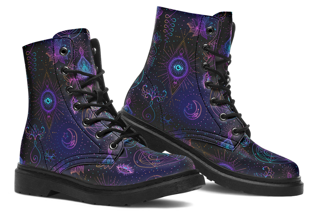 Boots featuring a dark violet, almost black background with a rainbow gradient pattern of different symbols such as a lotus flower, moon, star, decorative dots and swirls and a blue eye surrounded by a circle and line patterns.