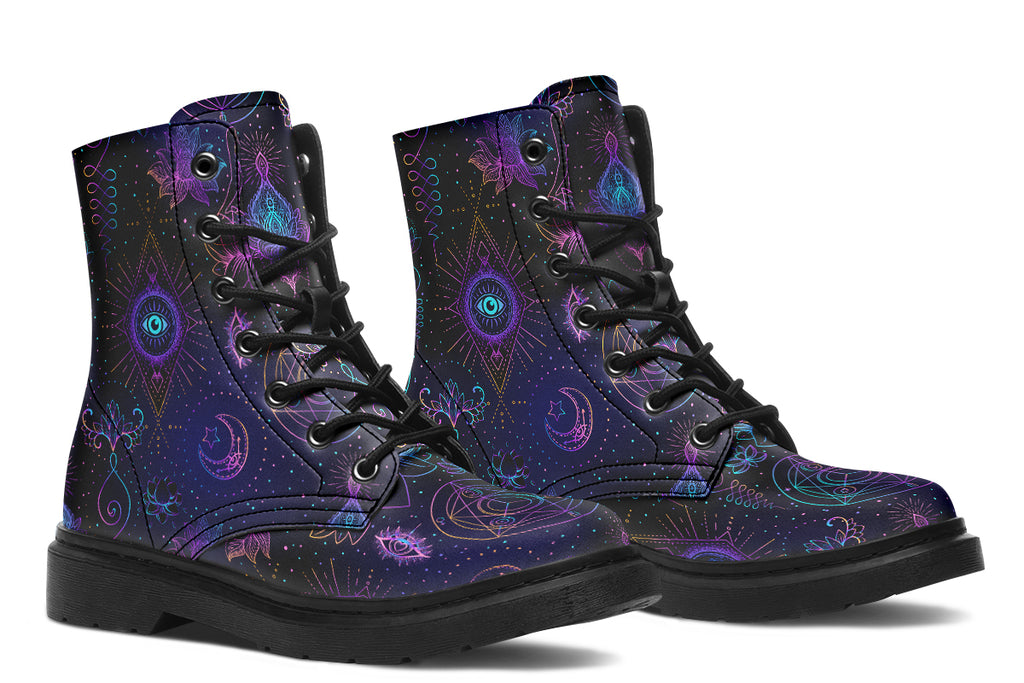 Boots featuring a dark violet, almost black background with a rainbow gradient pattern of different symbols such as a lotus flower, moon, star, decorative dots and swirls and a blue eye surrounded by a circle and line patterns.